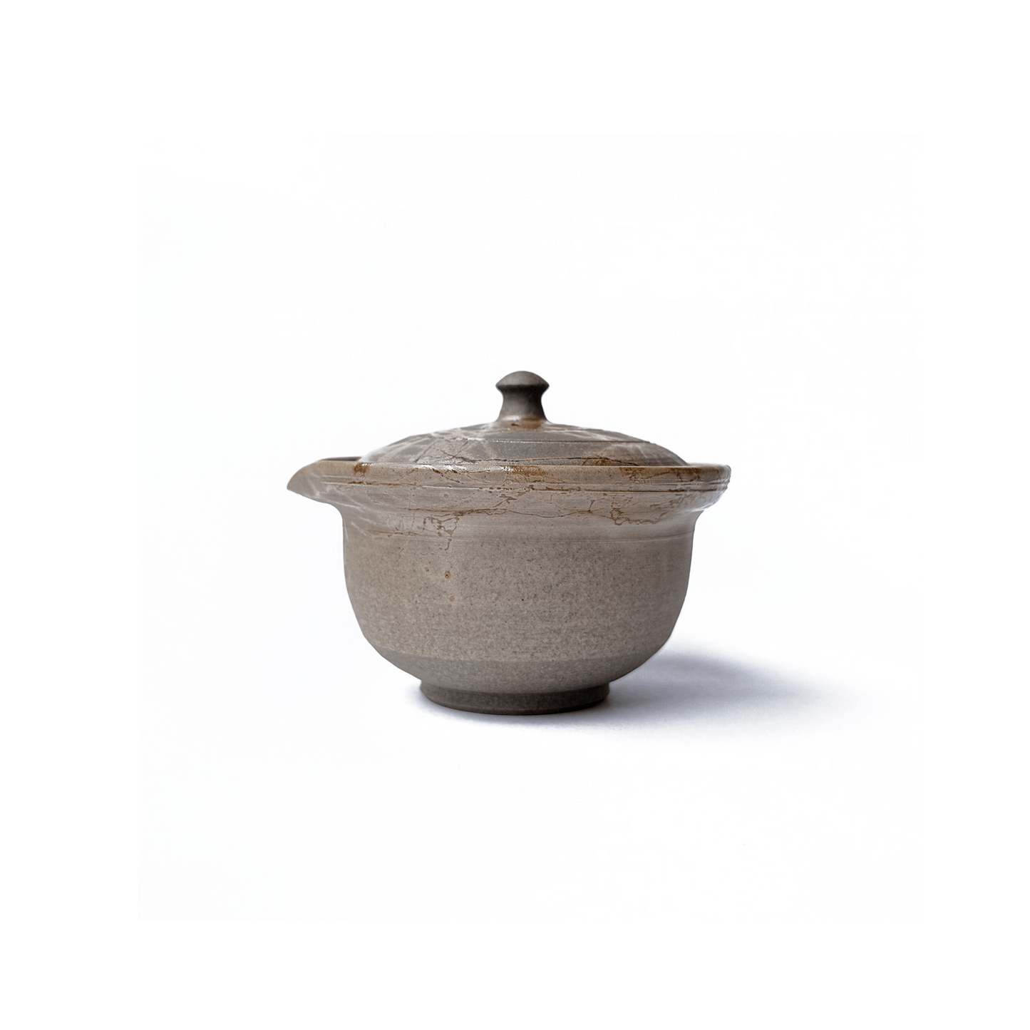 Side view of Akikusa Shiboridashi teapot on a white background