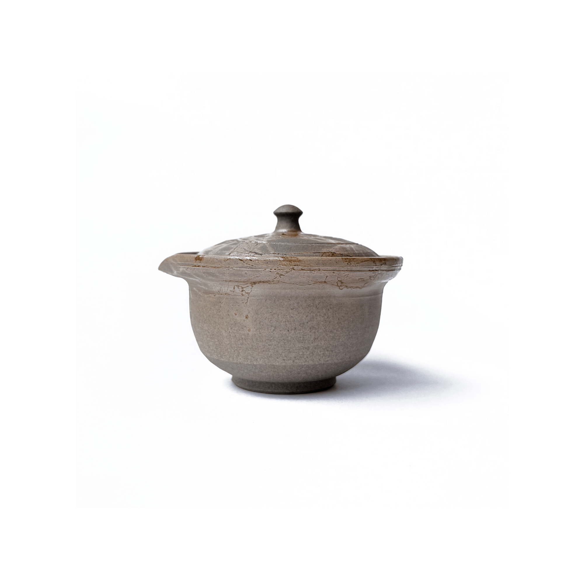 Side view of Akikusa Shiboridashi teapot on a white background