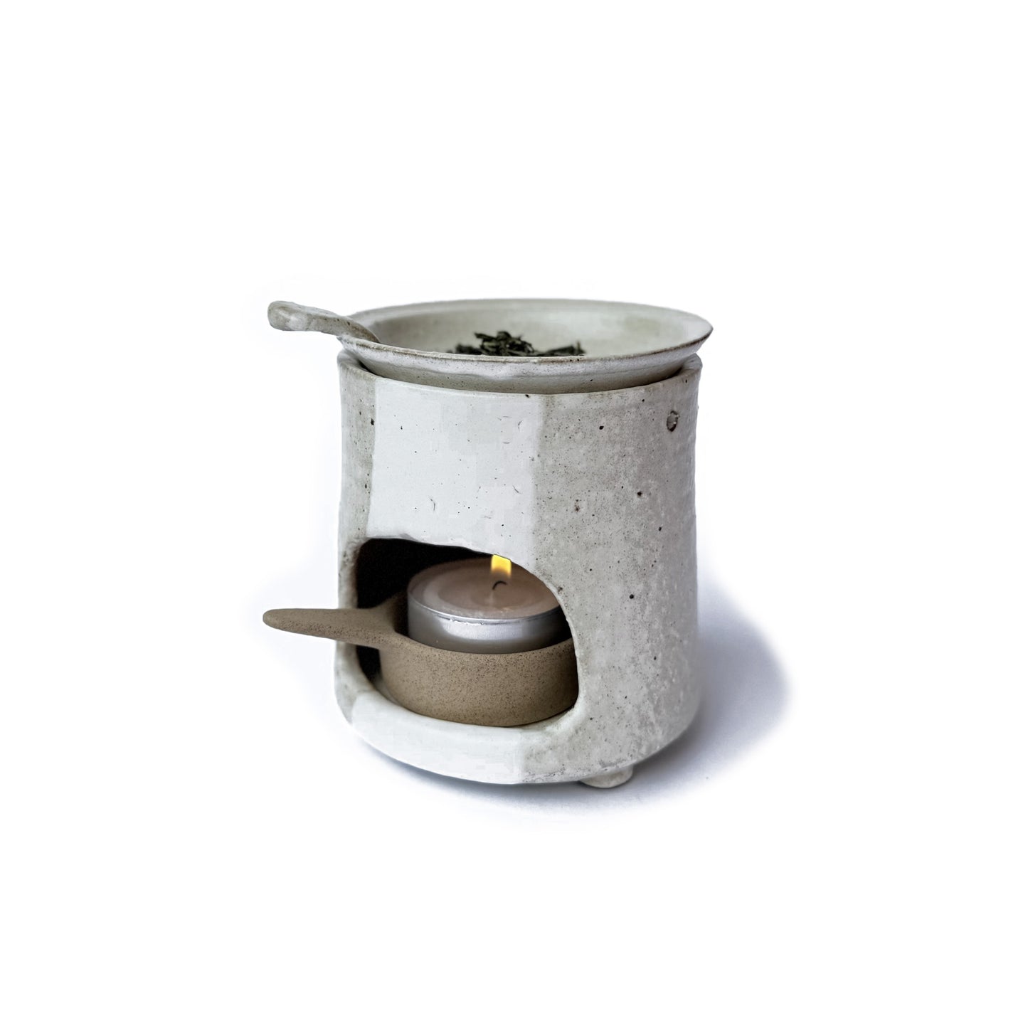 Charkoro tea diffuser with a tea of top on a white background