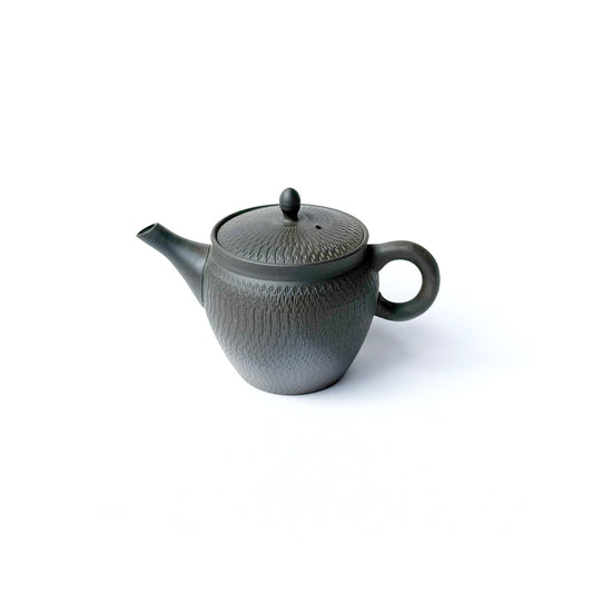 GYOKKOTO BIKANNA Teapotwith a back handle and a unique pattern, predominantly in a bronze to black color range, with a built-in mesh-shaped tea strainer.