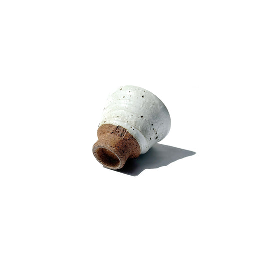 Small HANTEN Ceramic teacup with textured surface on a white background