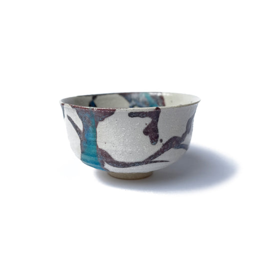 handcrafted KAWA Matcha Bowl ceramic matcha bowl with an organic pattern in deep plum and turquoise glaze on a white clay body, photographed against a white background.