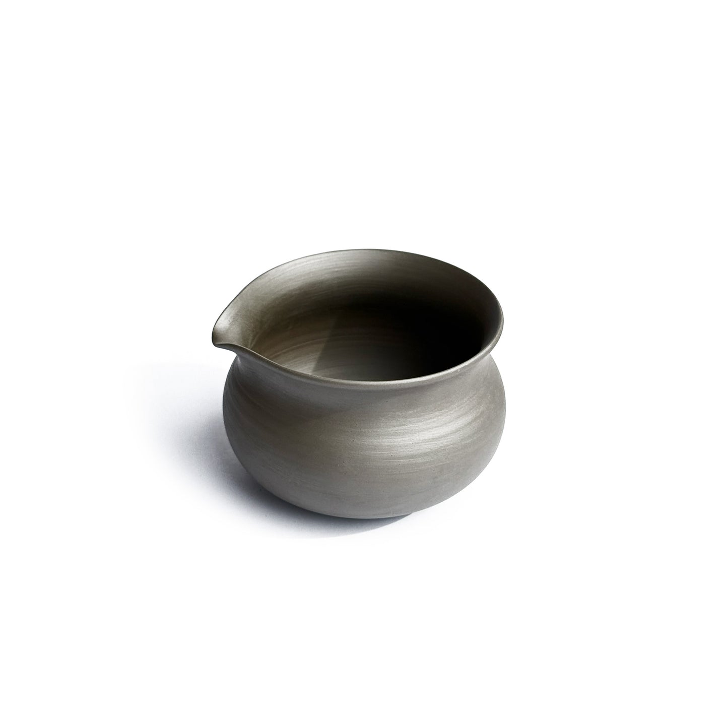 Side view of KITOBI water cooling vessel showing graceful pour spout and ergonomic handle for tea preparation