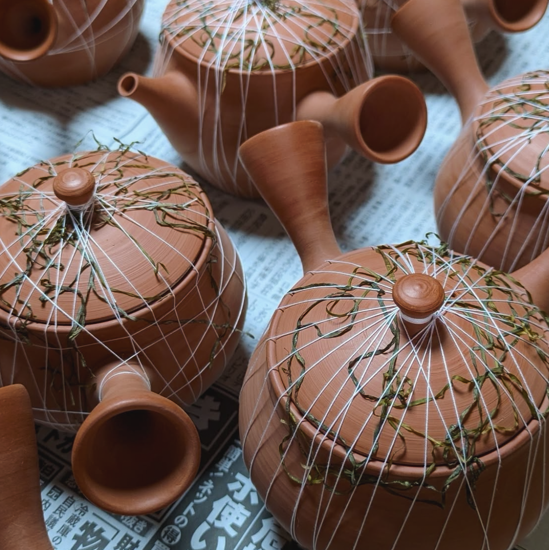 MOGAKE teapots with swaweed wrapping on the surface