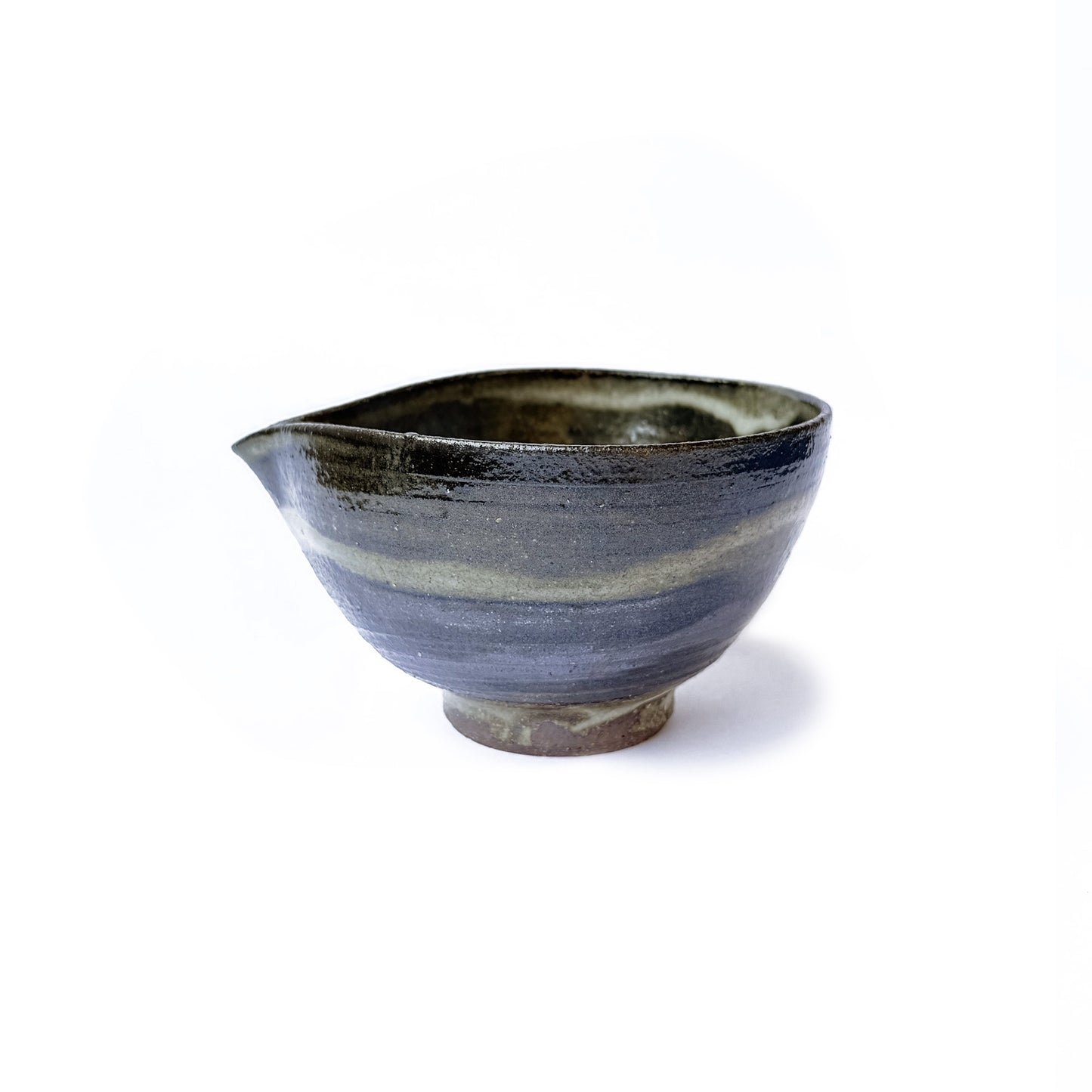Handcrafted Orora matcha bowl in earthy green glaze with speckled texture