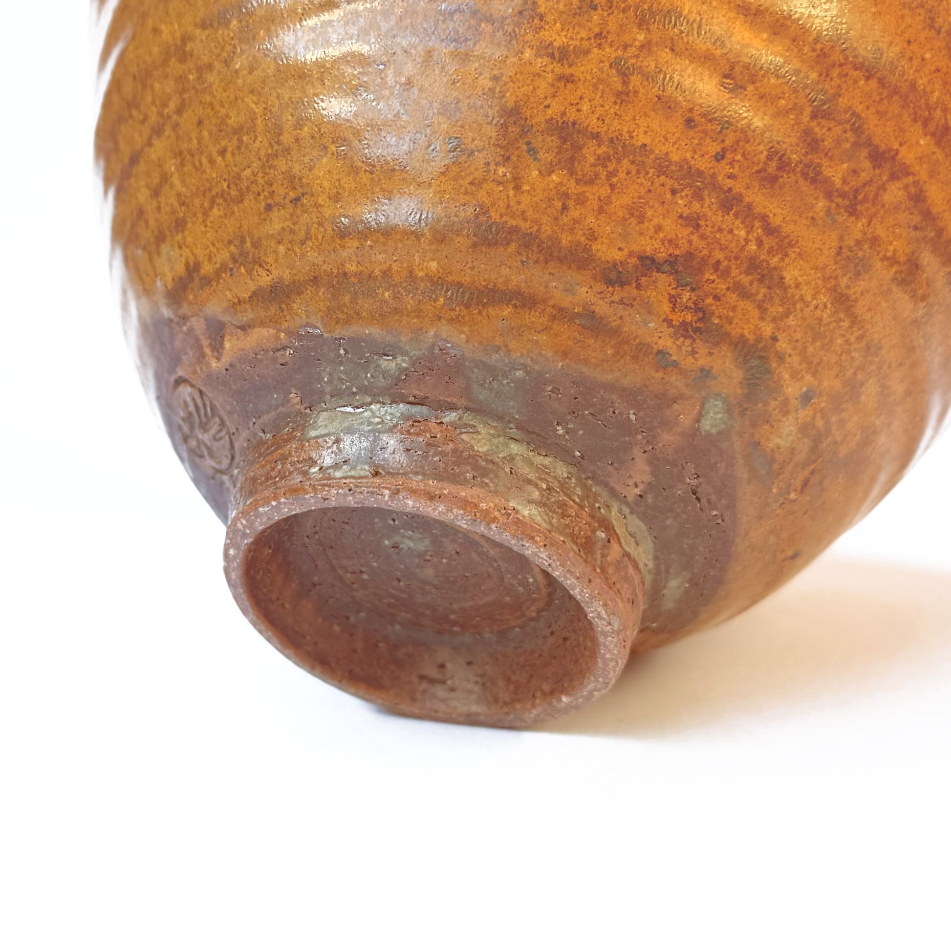 bottom of RAKU ceramic matcha bowl with artist signature on the side