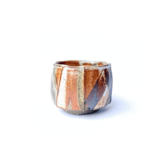 SHINO Ceramic cup with geometric pattern on a white background