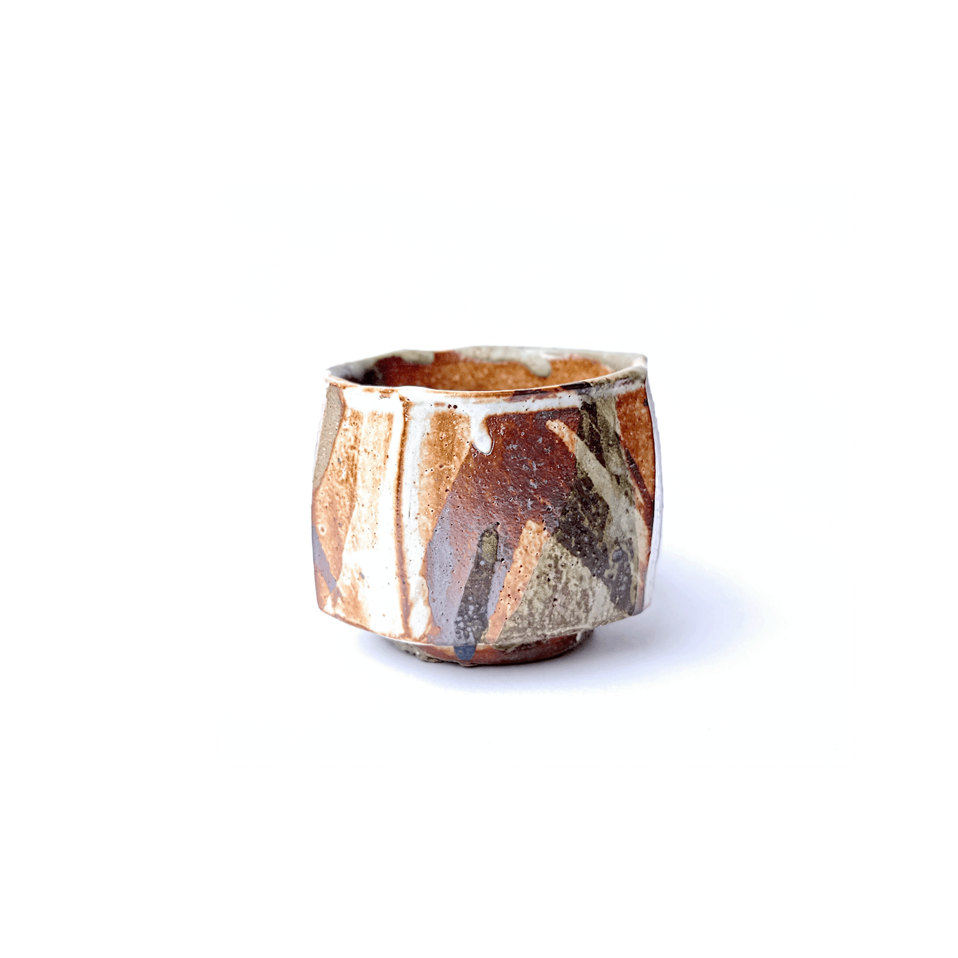 SHINO cup with a unique pattern on a white background
