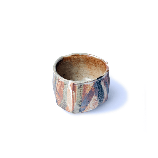 SHINO cup with multicolored pattern on a white background