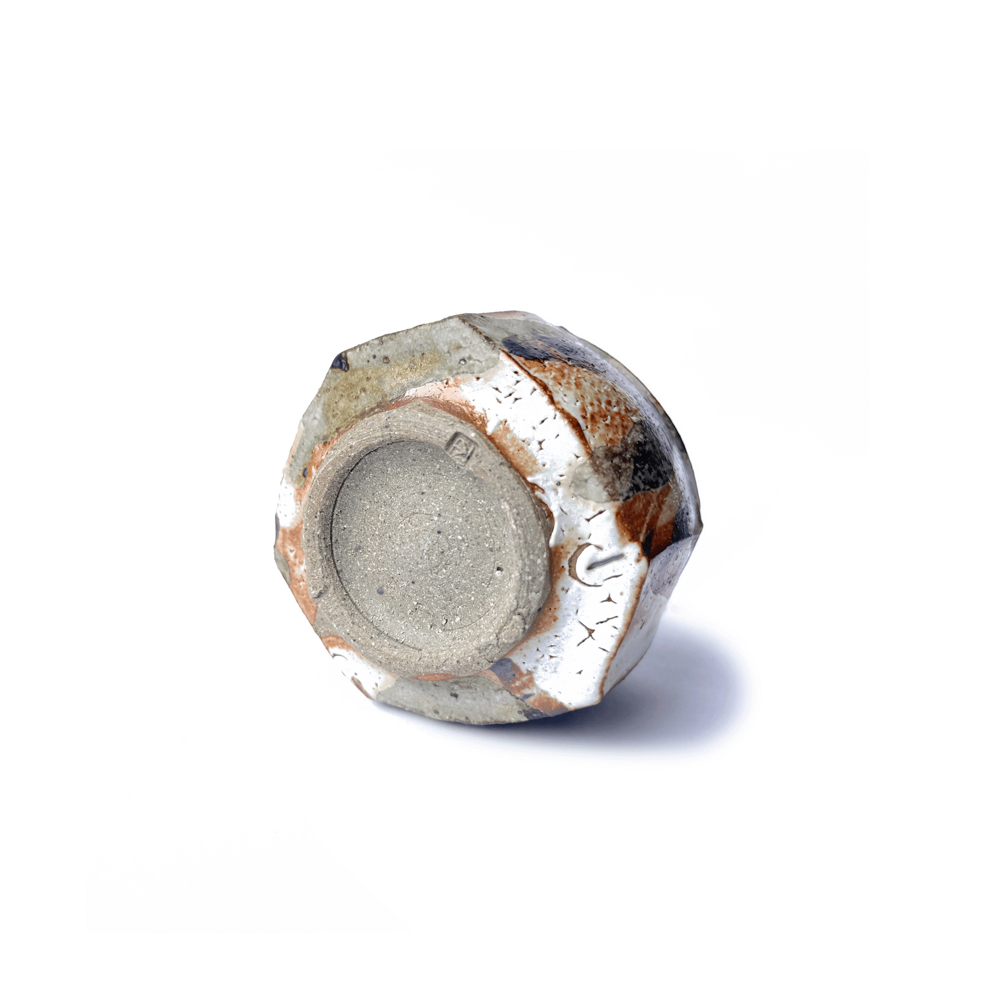 Bottom of SHINO cup on a white background