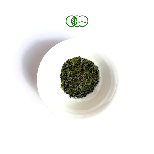 SUGI Green tea leaves in a white plate on a white background