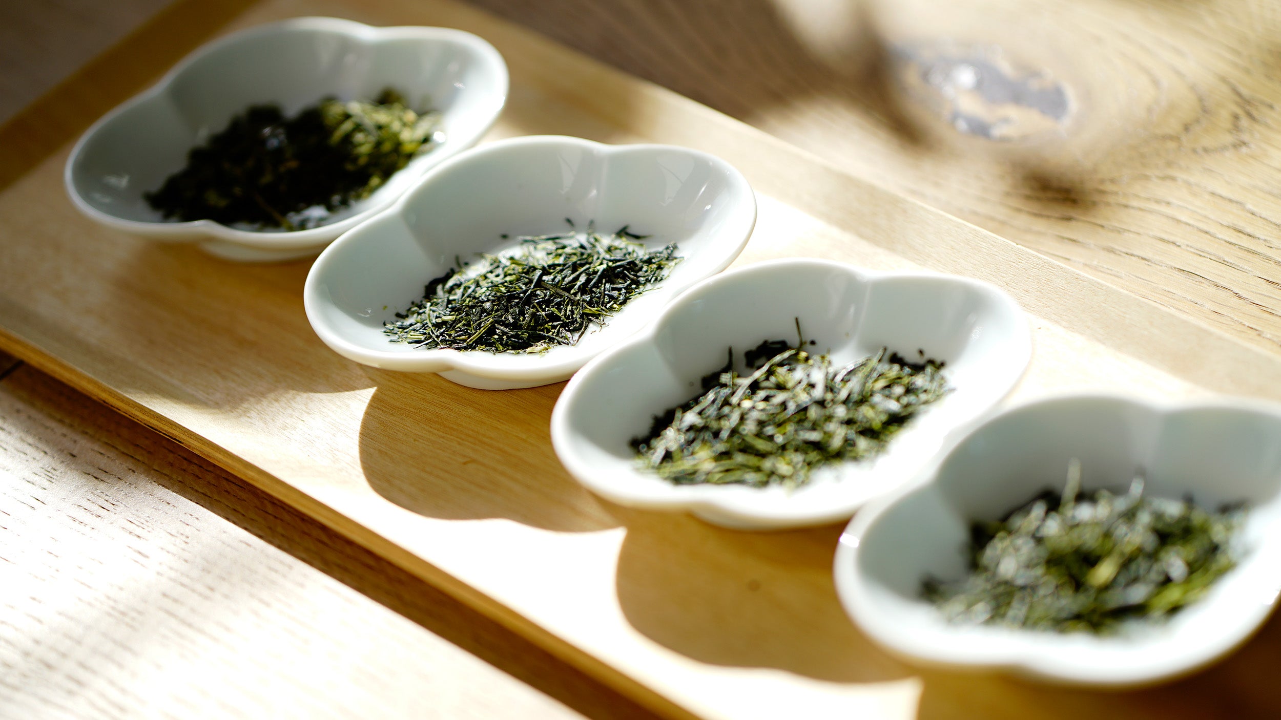 Tea leaves places on different small plates
