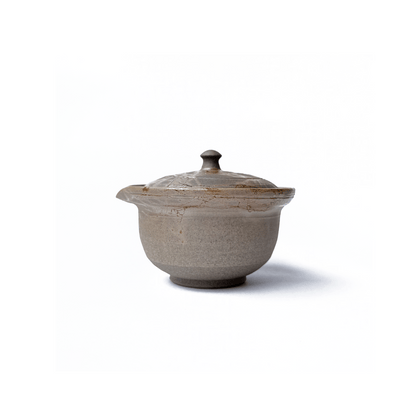 Side view of Akikusa Shiboridashi teapot on a white background