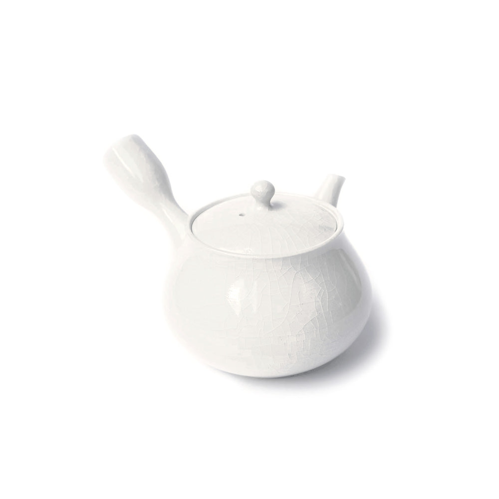 A small white ceramic teapot with a textured glaze, featuring a lid with a small knob, a curved handle, and a short spout, shown on a plain white background.
