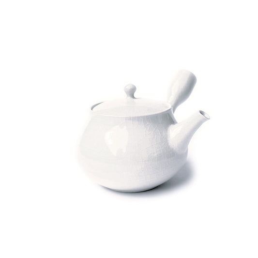 A white ceramic teapot with a glossy, crackled glaze, featuring a rounded body, a small curved spout, and a matching lid with a small knob, set against a plain white background.
