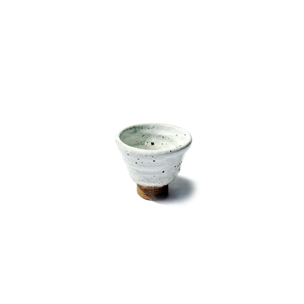 Small HANTEN teacup with a textured surface on a white background