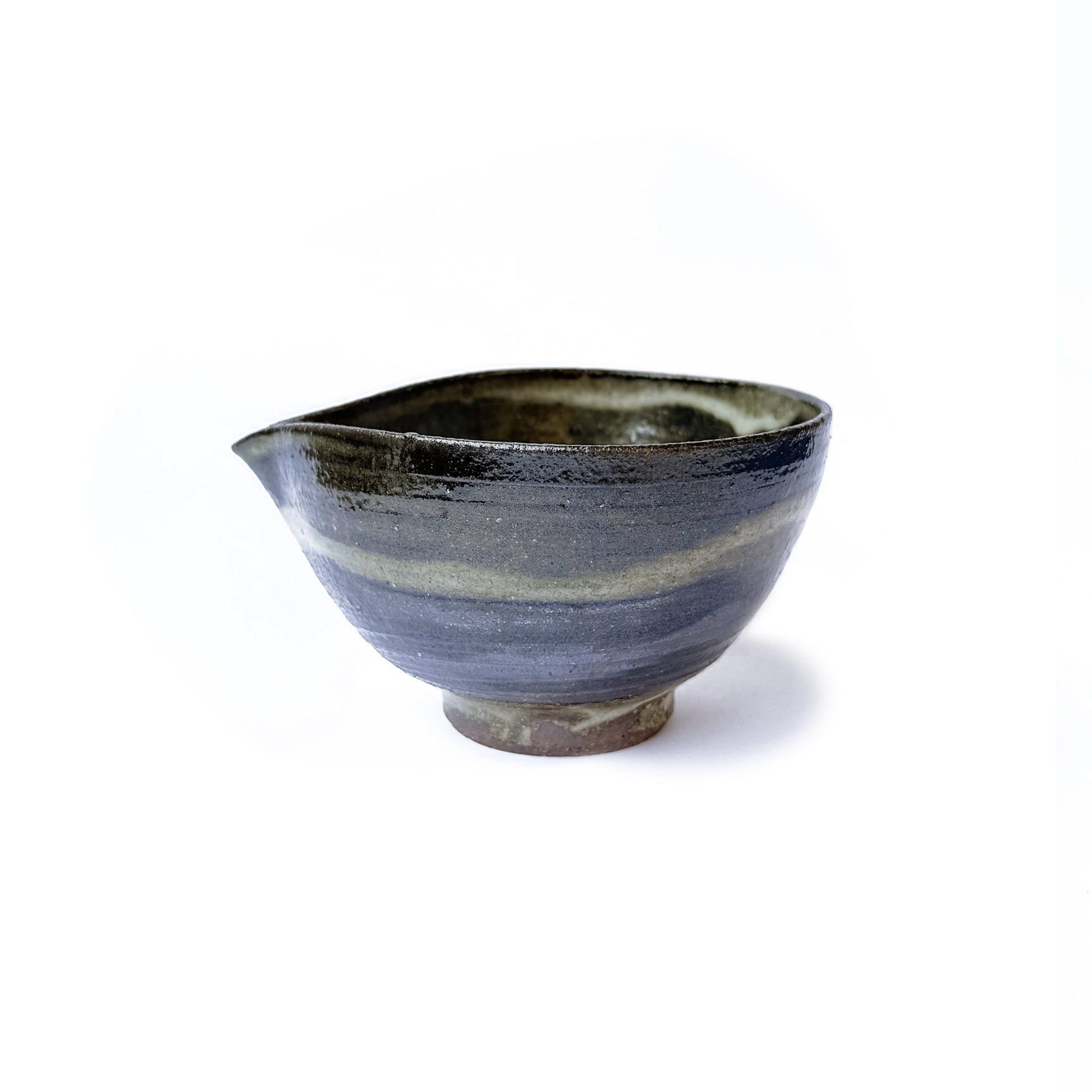 Handcrafted Orora matcha bowl in earthy green glaze with speckled texture