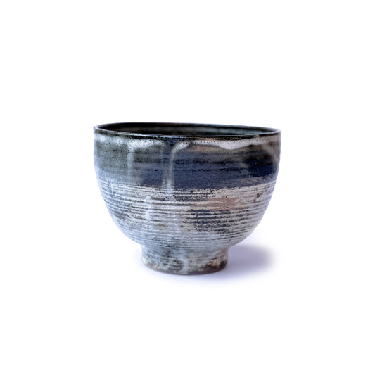 Orora Matcha Ceramic bowl with irgular pattern glaze on a white background
