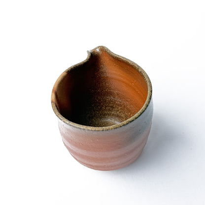 Detail view of SANGIRI water cooler's unique texture and craftsmanship, an essential tool for precise tea preparation