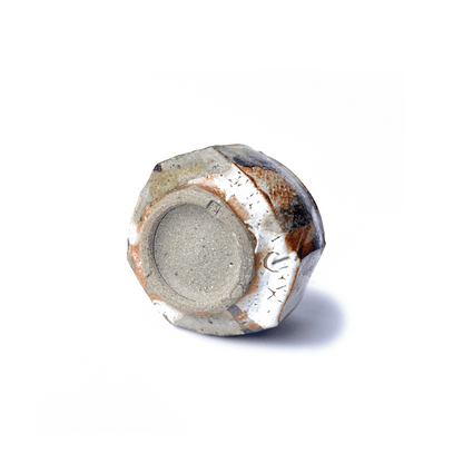 Bottom of SHINO cup on a white background