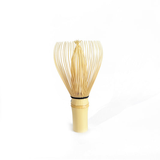 Traditional bamboo matcha whisk (chasen) with fine tines for creating smooth, frothy matcha