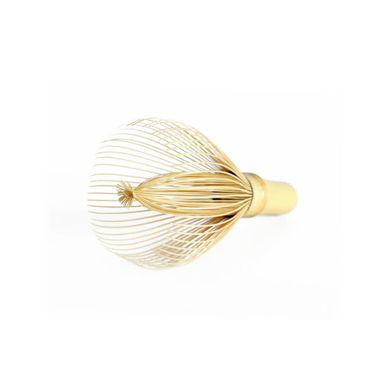 Handcrafted bamboo matcha whisk shown from above, displaying intricate tine pattern for optimal whisking