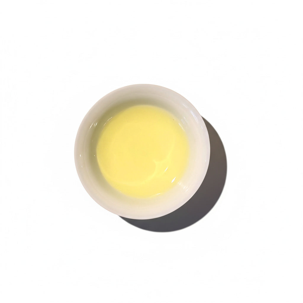 TSUTA tea in a white porcelain teacup