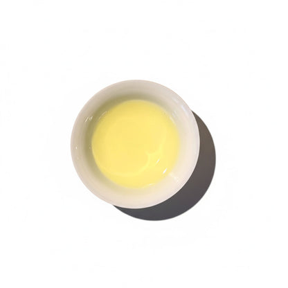 TSUTA tea in a white porcelain teacup