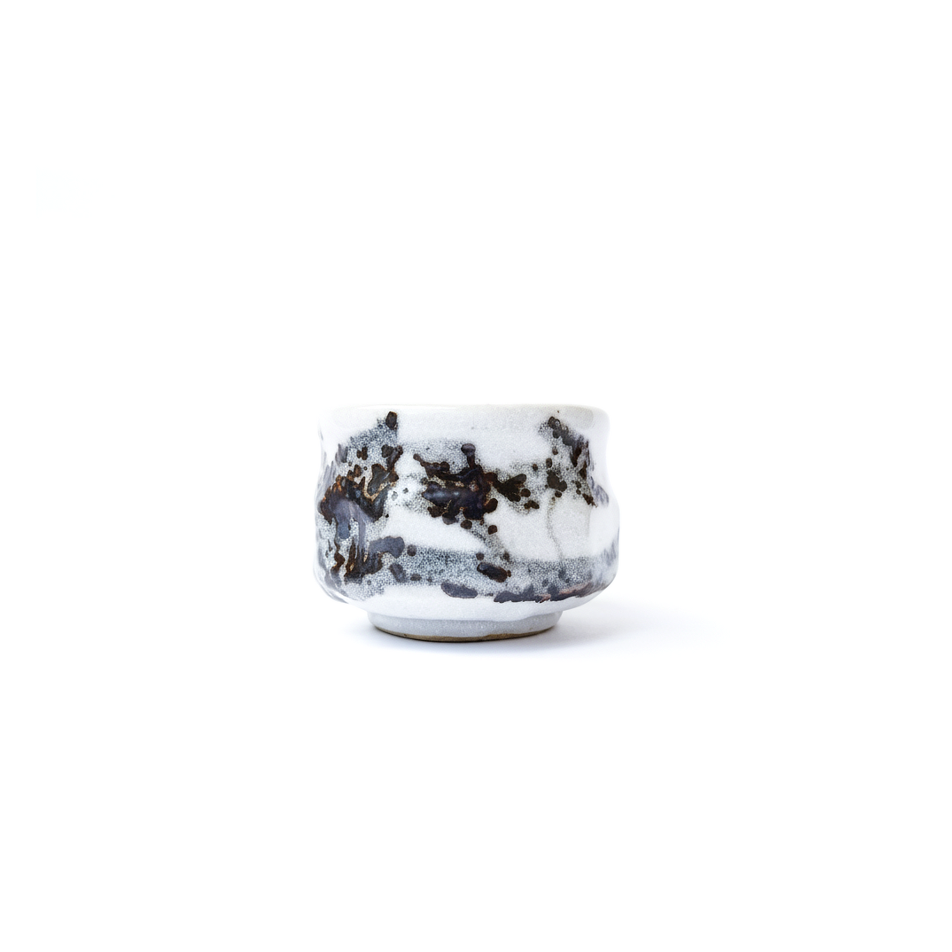 YUKIMI White ceramic cup with black speckles on a white background