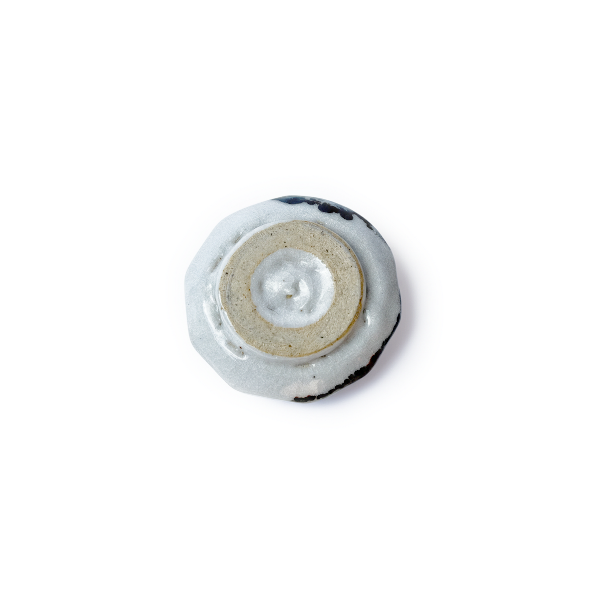 Bottom of YUKIMI teacup on a white background